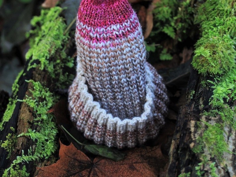 A hand-knit hat of wool, warm and colourful
